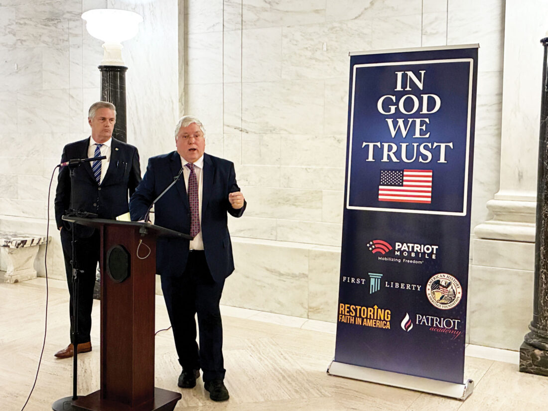 Morrisey, Azinger celebrate private purchase of ‘In God We Trust’ signs for public schools, colleges